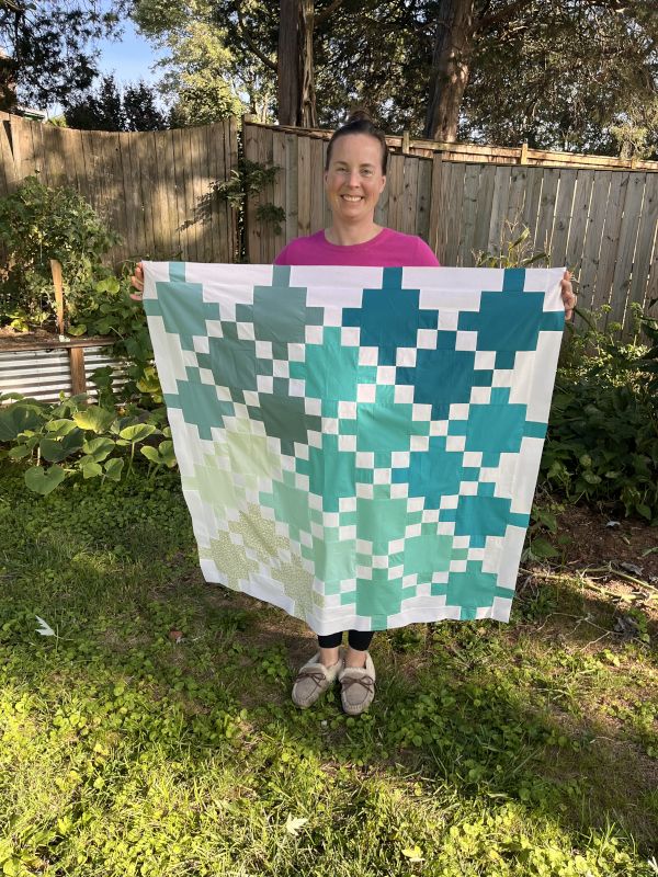Jen With a Quilt She Made