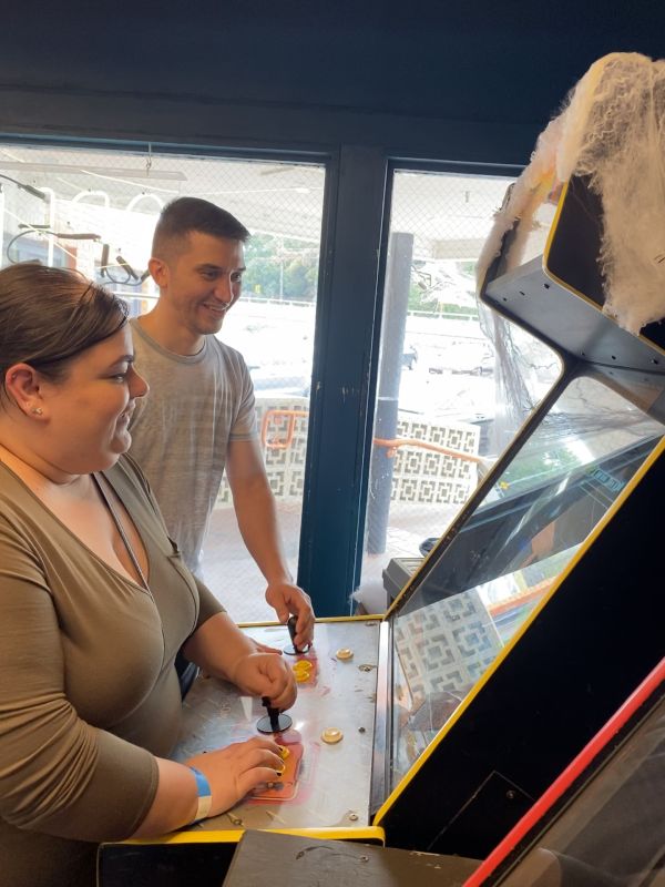 Noida & a Friend Having Fun at an Arcade